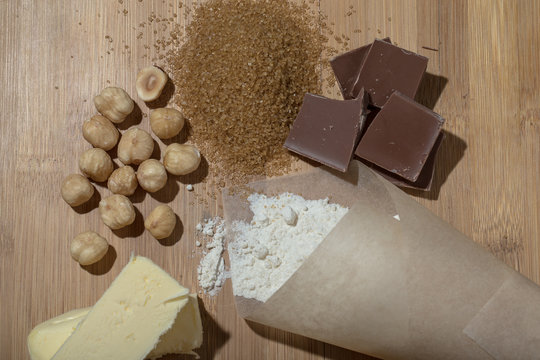 Ingredients for baking on light wooden table like background. Se