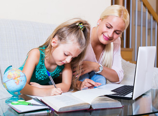 Fototapeta premium Woman and child having lesson