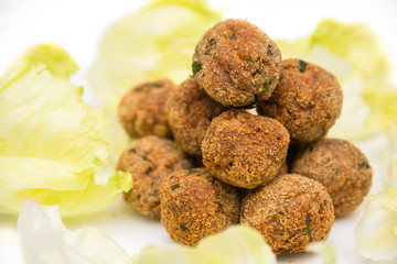 Fried beef meatballs and lettuce, Italian food