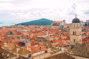 Fototapeta premium Church tower and red roofs in old town Dubrovnik, Croatia, UNESCO site, panoramic view 