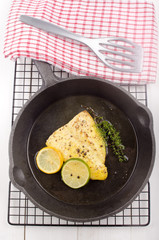 grilled cod with thyme in a pan