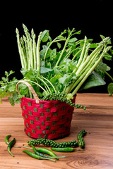 vegetables in basket on wooden