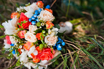 wedding bouquet with rings at pine forest