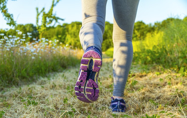Woman running in a field