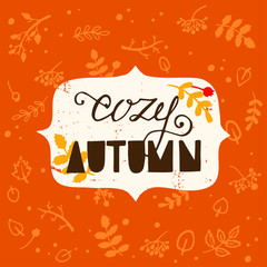 Cozy Autumn hand lettering with leaves and berries