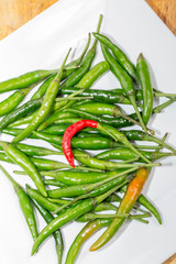 Green peppers  on white plate