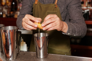 Bartender is adding egg white to shaker, making flip cocktail