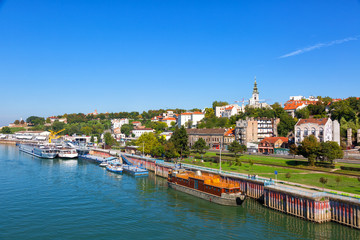 Belgrade from river Sava with tourist riverboats on a sunny day - obrazy, fototapety, plakaty