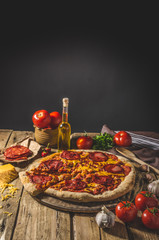 Rustic salami pizza with cheddar cheese and chorizo