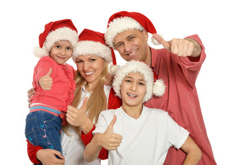 family with kids   in santa hats