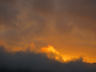 Fototapeta na wymiar Orange sunrise clouds