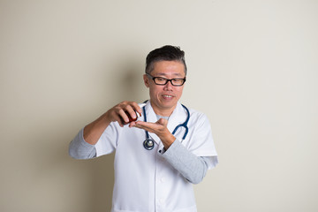 Asian doctor with medicine