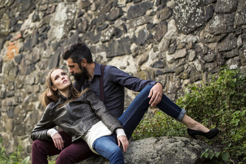 Couple near stony wall