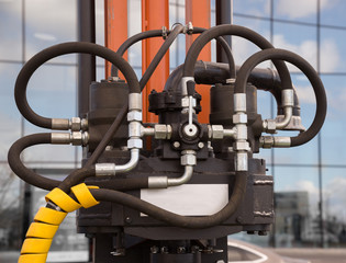 Hydraulic tubes, fittings and levers on control panel