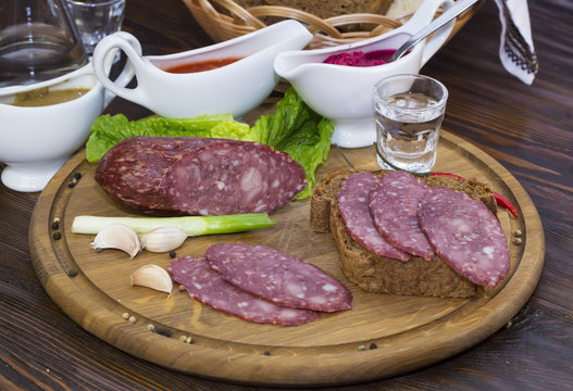 sausage on a wooden plate in a restaurant