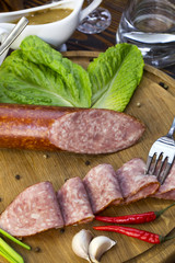 sausage on a wooden plate in a restaurant