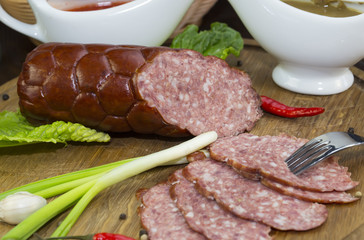 sausage on a wooden plate in a restaurant