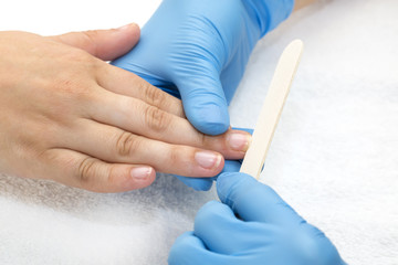 woman doing manicure beauty salon varnish wellness