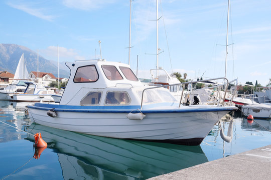 The image of an passenger motor boat in a hubborn of Tivat, Montenegro