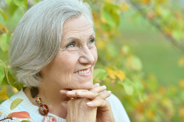 senior woman in summer park