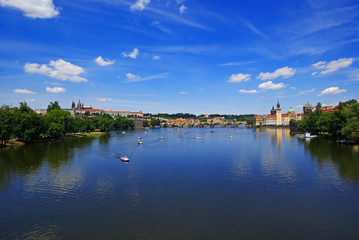 Fototapeta na wymiar View of the Charles Bridge and Prague Castle from the river Vltava in Prague Czech Republic