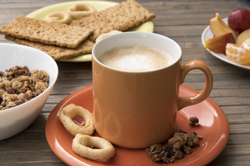Italy in the morning, breakfast with a cappuccino and savory bagels and fruit