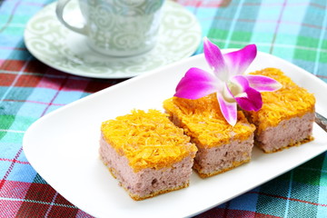 Gold Egg Yolk Thread Cakes on white plate and coffee.