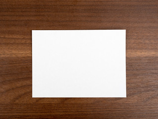 Blank card on wood table
