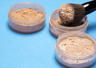 Loose cosmetic powder in jars