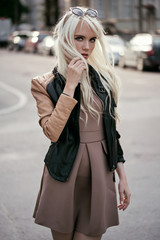 Fototapeta premium Blonde young girl in posing outside