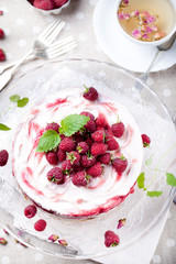 Raspberry, cheesecake with rose buds tea and fresh mint 