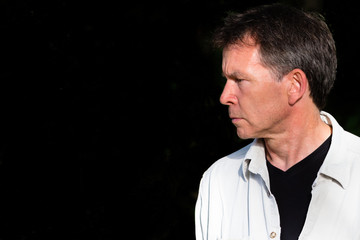 Senior man on black background