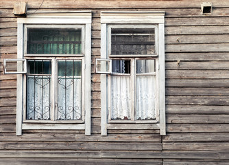 Fragment of old rural wooden wall with windows