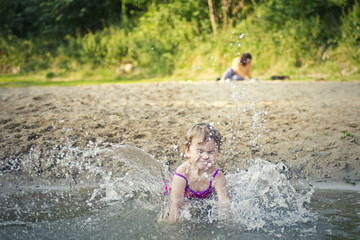 Small girl fall in the water
