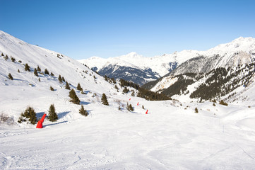 Fototapeta na wymiar View of a ski slope in mountains
