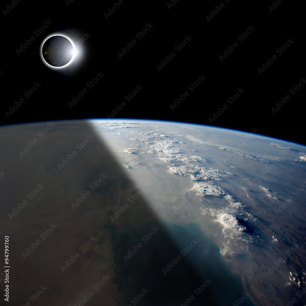 Wall mural eclipse from above - elements of this image furnished by nasa.