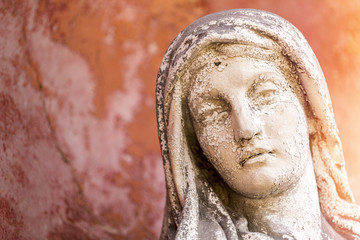 portrait of a weathered maria sculpture