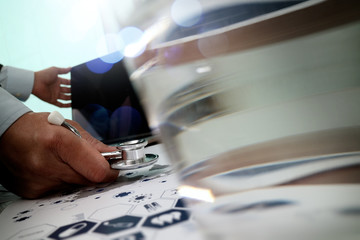 Medicine doctor hand working with modern computer and smart phon