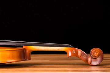 Naklejka na ściany i meble Vintage violin on wooden background