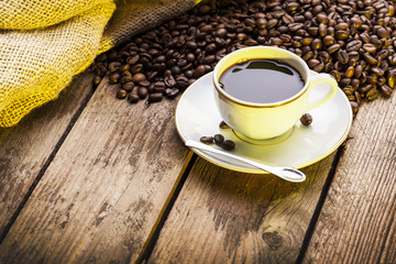 Cup of coffee on aged wooden table
