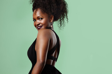 black woman turning back and watching in camera