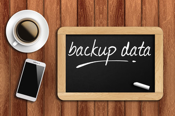 coffee, phone  and chalkboard with word backup data
