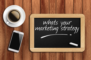 coffee, phone  and chalkboard with word whats your marketing str