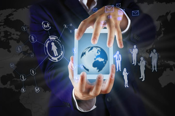 Businessman holding tablet-pc with social network structure