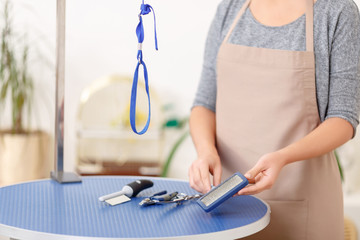 Groomer showing salon necessities