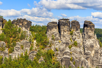 Fototapeta na wymiar Panorama with typical rock pinnacles at Bastei in Rathen, Saxon Switzerland