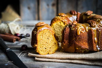  Homemade autumn cake with nuts and caramel on wooden background © ehaurylik
