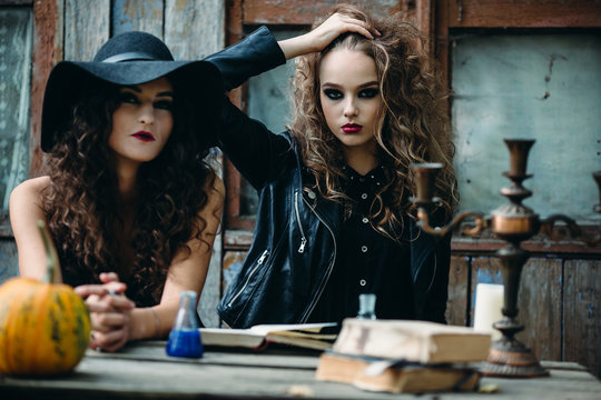 Two vintage witch sitting at the table