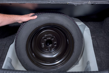 Rubber spare tire removed the trunck of a car