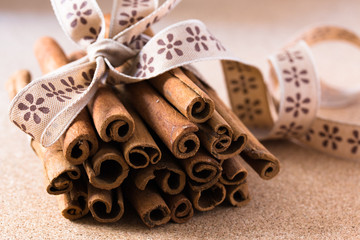 Cinnamon sticks tied with ribbon.